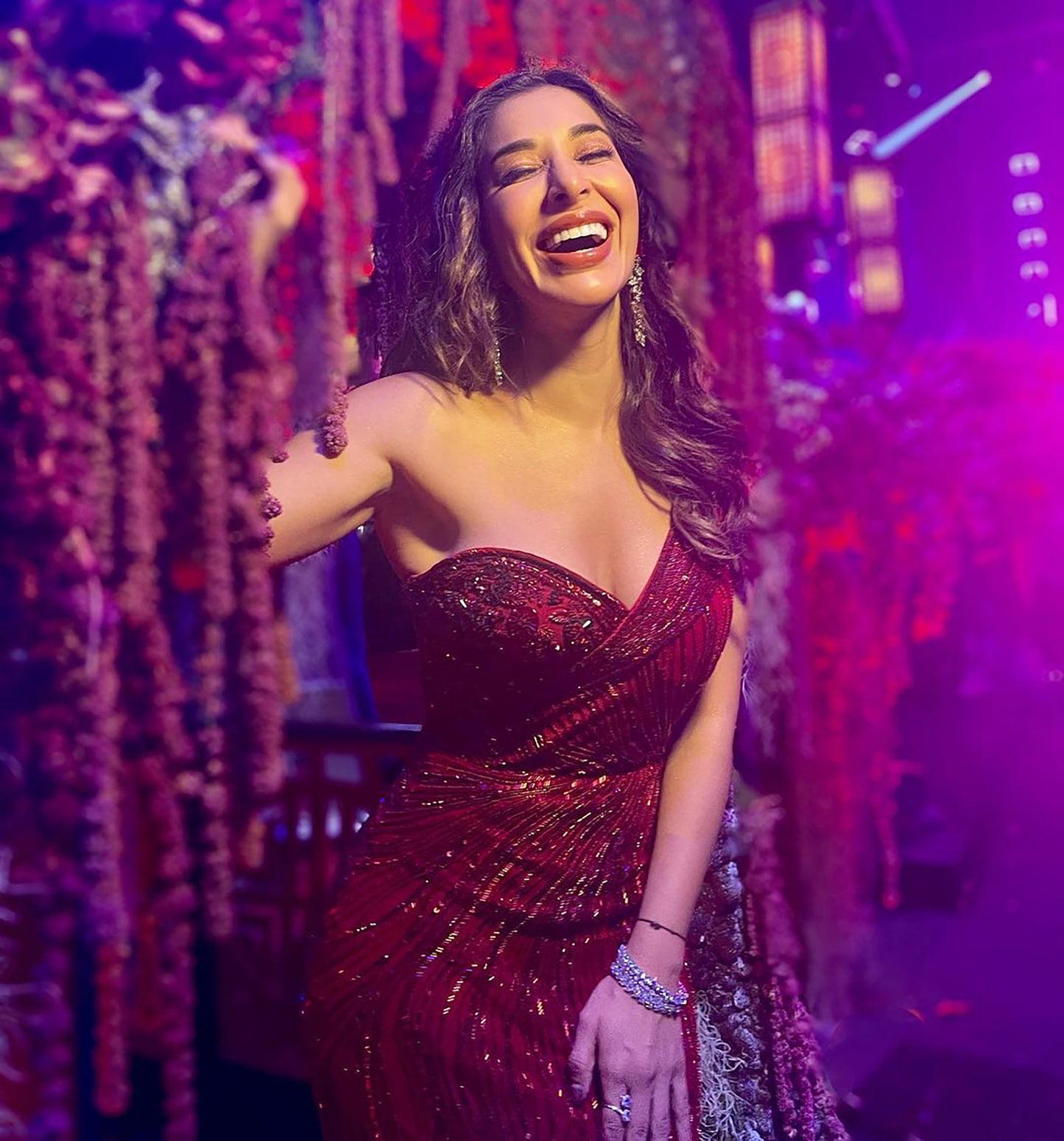 SOPHIE CHOUDRY IN RED ONE SHOULDER GOWN